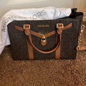 Brown signature MK crossbody/shoulder bag with gold accents.